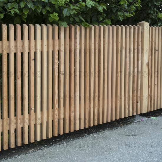 Wooden fence on the side of the road, vertical slats, town of Tegernsee, Upper Bavaria, Bavaria,