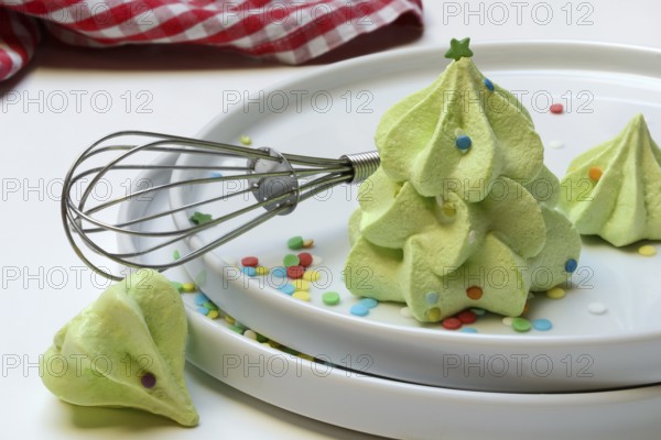 Meringue in the shape of a Christmas tree and whisk, Christmas cookies, meringue
