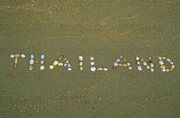 Thailand written with shells in the sand on the island of Ko Lanta, Thailand, December 2002,