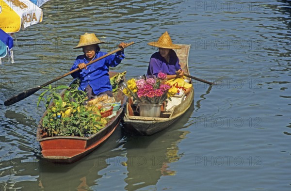 Merchants in their boats at Damnoen Saduak Floating Market, Thailand, December 2002, vintage,