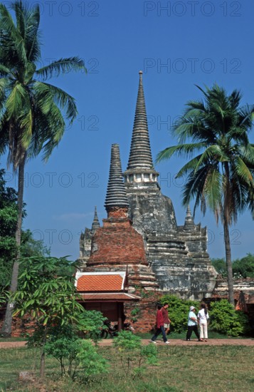 People, Chedis, palm trees at Wat Phra Si Sanphet, Ayutthaya, Thailand, December 2002, vintage,