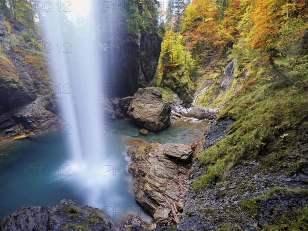 Waterfall mountain list in autumn-colored surroundings, Linthal, Klausenpass, Canton of Glarus,