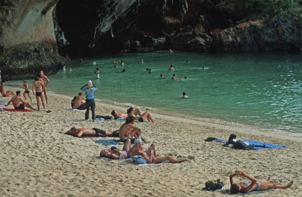 People bathing and sunbathing on Pranang Cave beach, two years in front of the tsunami, Krabi,