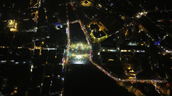 A Drone night view of Aleppo, Syria on December 19, 2025, showing illuminated streets, dense