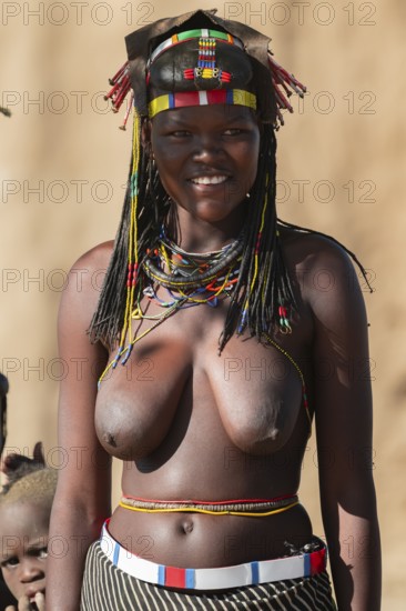 Portrait, brightly decorated woman of the Hakaona tribe, also Havakona or Hakawona, near Opuwo,