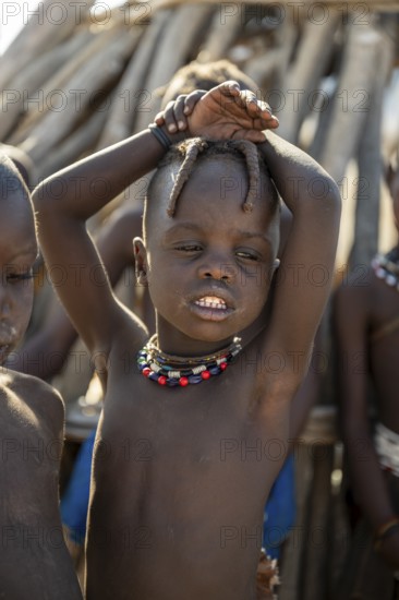 Portrait, Himba boy, traditional Himba village, Kaokoveld, Kunene, Namibia