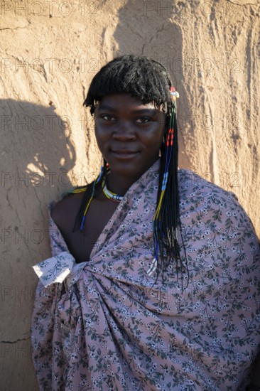 Portrait, brightly decorated woman of the Hakaona tribe, also Havakona or Hakawona, near Opuwo,