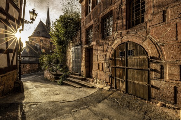 Historic alley with old charm and sunshine through the old town, The historic alleys and streets of