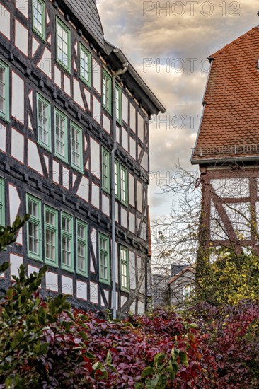 Historic half-timbered houses with red tiled roofs in autumn, The historic city center of Marburg