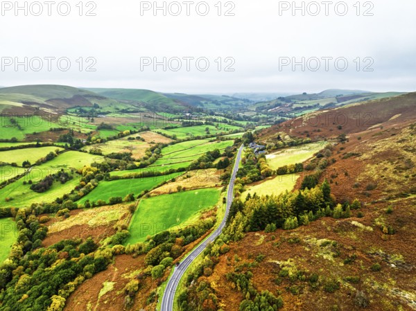 Autumn colours of Farms over River Wye and Road A470 from a drone, Llanidloes, Powys,
