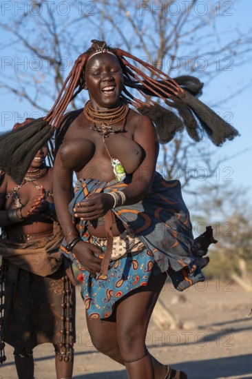 Himba woman dancing euphorically, traditional dance, traditional Himba village, Kaokoveld, Kunene,