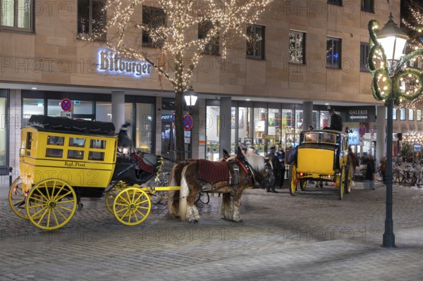 Historic stagecoach rides with horseback during the Nuremberg Christmas Market, Nuremberg, Middle