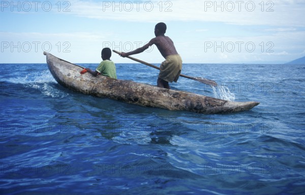 Two boys in a dugout on Lake Malawi, Malawi, Africa, July 2000, vintage, retro, old, historic