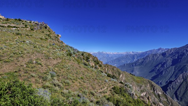 Landscape with a wide view of a mountainous landscape under clear, blue sky, The mountains and