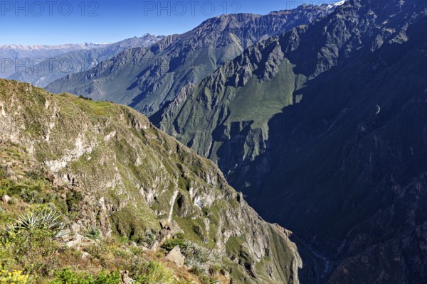 Extensive mountain landscape with deep gorge and sparse vegetation, The mountains and valleys of