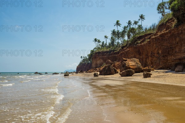 Lonely beach with red rocks and coconut trees, Red Cliffs, Bang Saphan Noi, Prachuap Khiri Khan