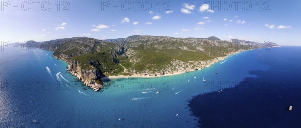 Picturesque rocky coast, cliffs and Cala Luna beach, aerial view, Golfo di Orosei, Baunei,