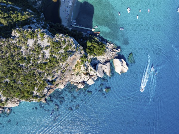 Picturesque rocky coast, cliffs and Cala Luna beach, aerial view, top-down, Golfo di Orosei,