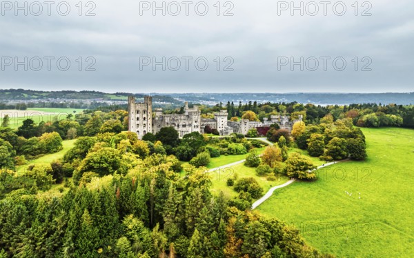 Autumn colours over Penrhyn Castle and Garden from a drone, Llandygai, Bangor, Gwynedd, North