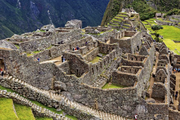 Stone Inca ruins of Machu Picchu surrounded by mountainous landscape, The ruins of the Inca city of