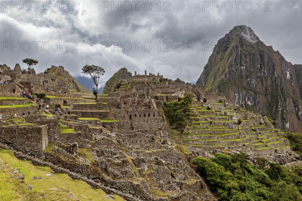 Historic ruins of Machu Picchu with impressive mountain scenery and clouds, The ruins of the Inca