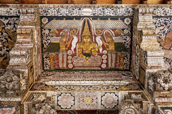 Detailed wall painting of a Buddha in a magnificent, decorative temple interior, the decoration