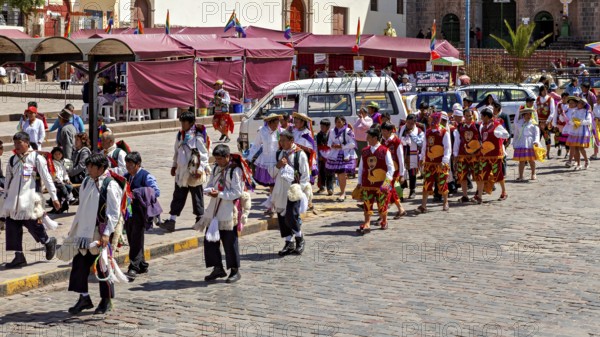 Large group of people wearing traditional costumes at a parade, traditional parade of festival