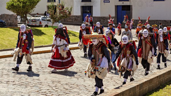 Group of people wearing masks and traditional garments at a parade, Traditional procession of