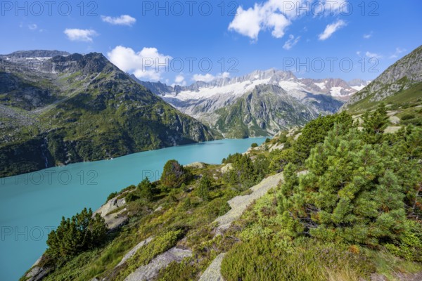 Turquoise blue mountain lake Göscheneralpsee, picturesque mountain landscape with dammastock and