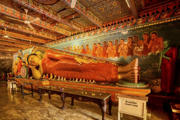 Reclining Buddha statue in Isurumuniya Rajamaha Viharaya temple, Anuradhapura, Sri Lanka
