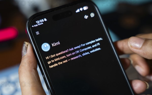 In this photo illustration, a person uses the Kimi AI chatbot on a smartphone, in New Delhi, India