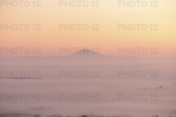 Hohenstaufen in the golden morning light, Aichelberg. Spectacular dawn over the foggy foothills of