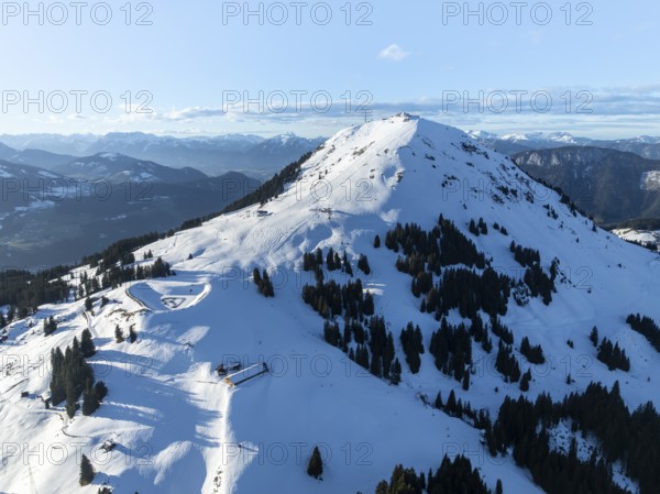 Wonderful winter landscape with Hohe Salve, blue sky and snow, mountains and mountain valley,