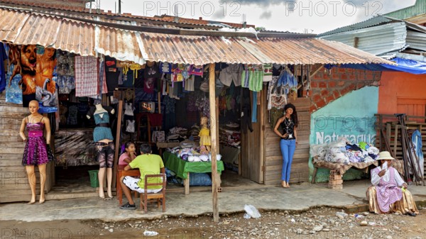 A small shop at a market with clothes and mannequins in a rural setting, The Rurrenabaque market in
