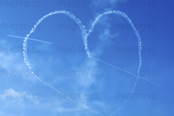 The Indian Air Force aerobatic team performs during an air show as part of the 93rd Air Force Day