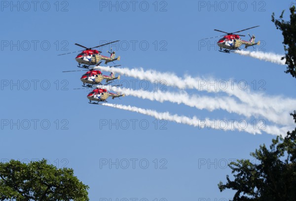 Indian Air Force (IAF) ALH Mk1 Sarang helicopters soar through the sky during an air show as part