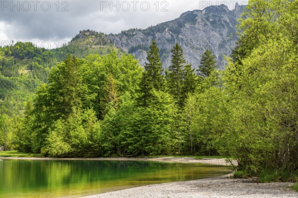 Landscape of Lake Offensee after rain when the sun comes through the clouds in spring,