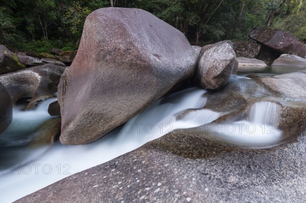 Turquoise blue water between rocks in the tropical rainforest of Babinda Boulders Queensland