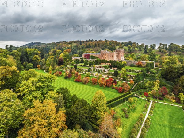 Autumn colours over Powis Castle and Garden from drone, Welshpool, Powys, Wales, England, United