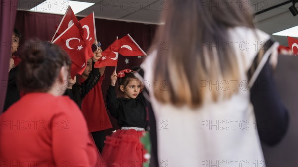 Children celebrate the 102nd anniversary of the Republic Day of Turkey, a national holiday
