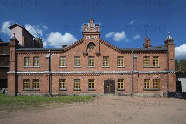 Brick façade with inscription Werla, former paper factory and mill for the production of groundwood