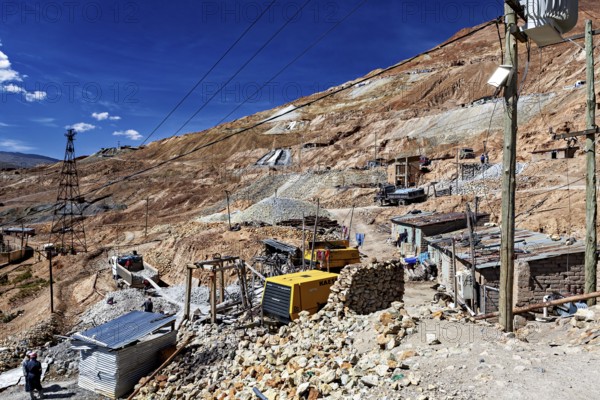 Huts and cable poles on the mountainside with an intense blue sky in the background, The silver