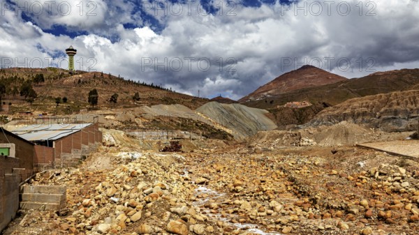 Wide, dry landscape with hills, cloudy skies and a radio tower, The landscape near Potosi in