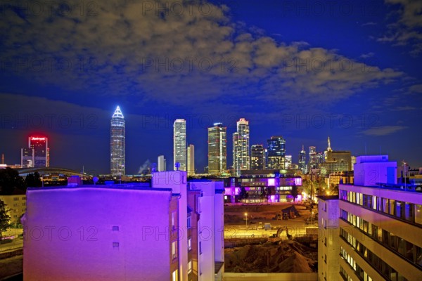 Rooftop day with colourfully illuminated houses for a techno party on the roof with a view of the