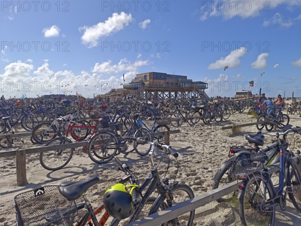 Car park for bicycles on the North Sea beach, Pfahlbau Strandbar 54° Nord, summer, sun, sand, on