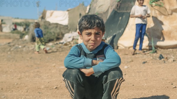 Syrian children playing in a refugee camp near the Turkish border on World Children's Day. Aleppo,
