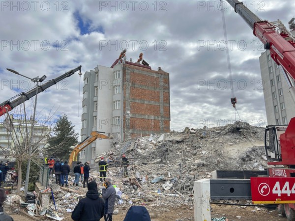 Turkish civil defense teams (AFAD) search for survivors under the rubble after a powerful 7