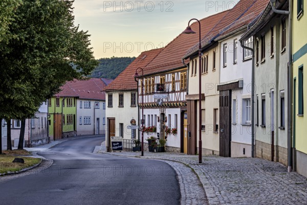 Idyllic old town with half-timbered houses and cobbled street in a quiet evening mood, the village