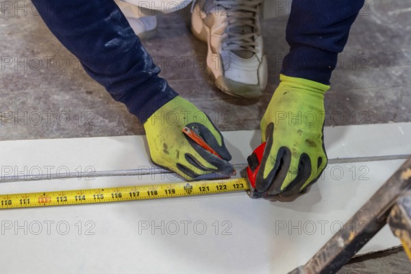 Detroit, Michigan - Workers remodel a house in the Morningside neighborhood that had been vacant