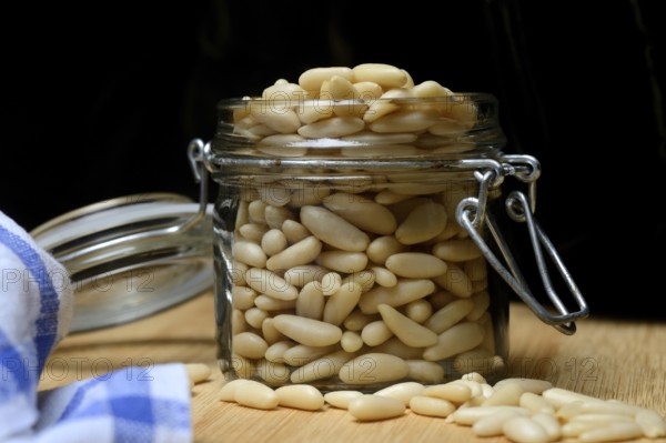 Pine nuts in glass containers, Pinus pinea